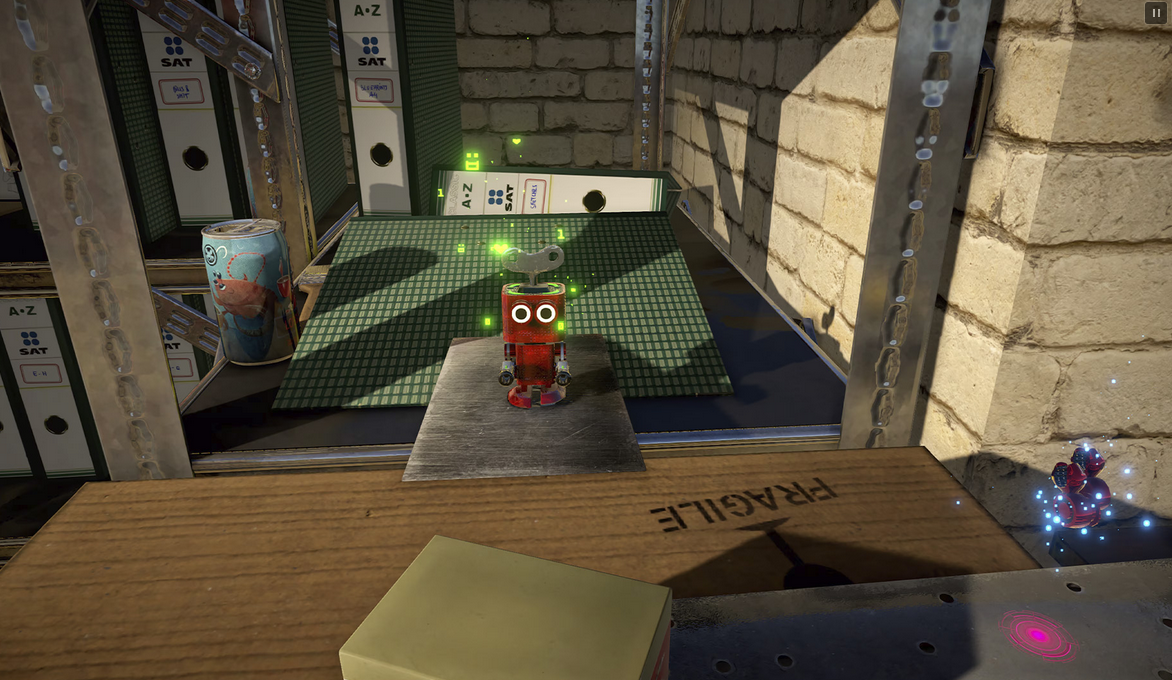 Small robot on a table with a cardboard box labeled 'FRAGILE' in a room with shelves and boxes.