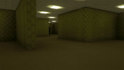 A dark, empty room with dim overhead lights, patterned wallpaper, and a small dark figure standing in the distance.