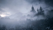 Mysterious castle in the fog with mountains in the background