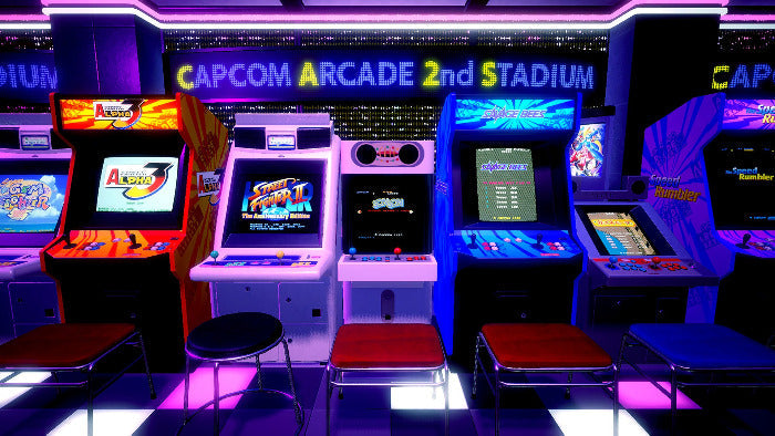 Arcade machines in a row with Capcom branding at an arcade.