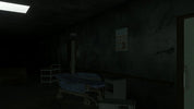 Dark room with a bed and medical equipment
