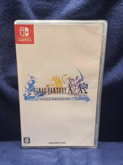 Nintendo Switch game case for 'Final Fantasy X + X-2 HD Remaster' on a blue fabric background