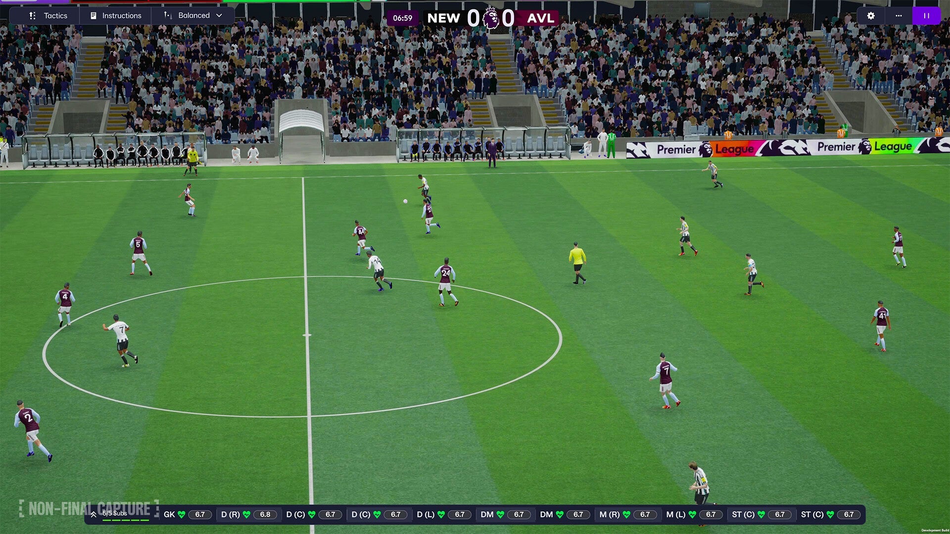 Soccer match in progress with players on a field, surrounded by stadium seats and advertisements.
