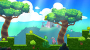 Cartoon landscape with trees, bushes, and a character in a platform game setting.