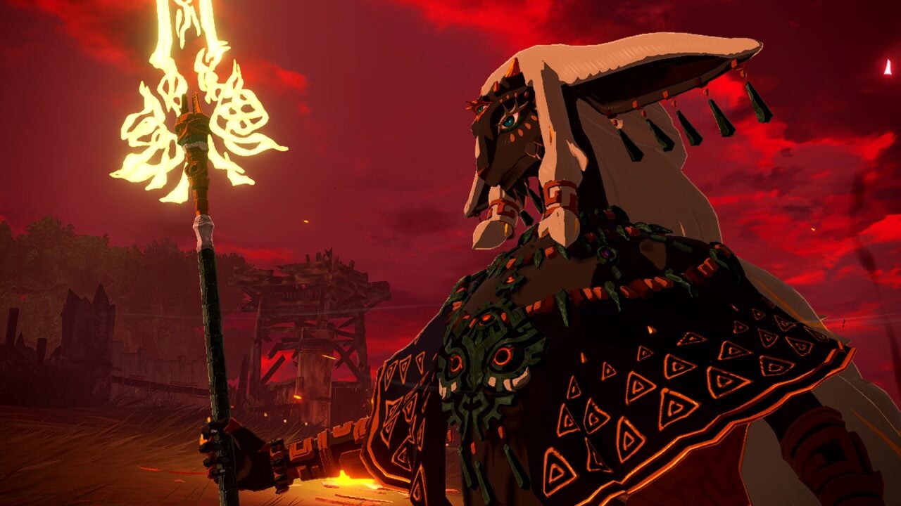 Character in ornate armor holding a flaming weapon against a red sky