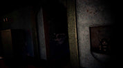 A dark, atmospheric scene showing a dimly lit interior with a doorway, textured walls, and a small framed object on the right wall.