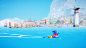 Toy figure in a blue swimsuit with a blue umbrella on a blue surface, with a scenic background.