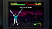 Vintage video game screen showing a character with glowing blue energy weapons against a dark landscape.