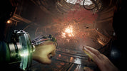 Close-up of a hand holding a futuristic weapon with a dark, industrial background
