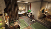 A cozy, compact studio apartment or tiny home interior with light wood-paneled walls, a desk setup with a computer, green rugs, curtains, a bed with pillows, and warm string lights.