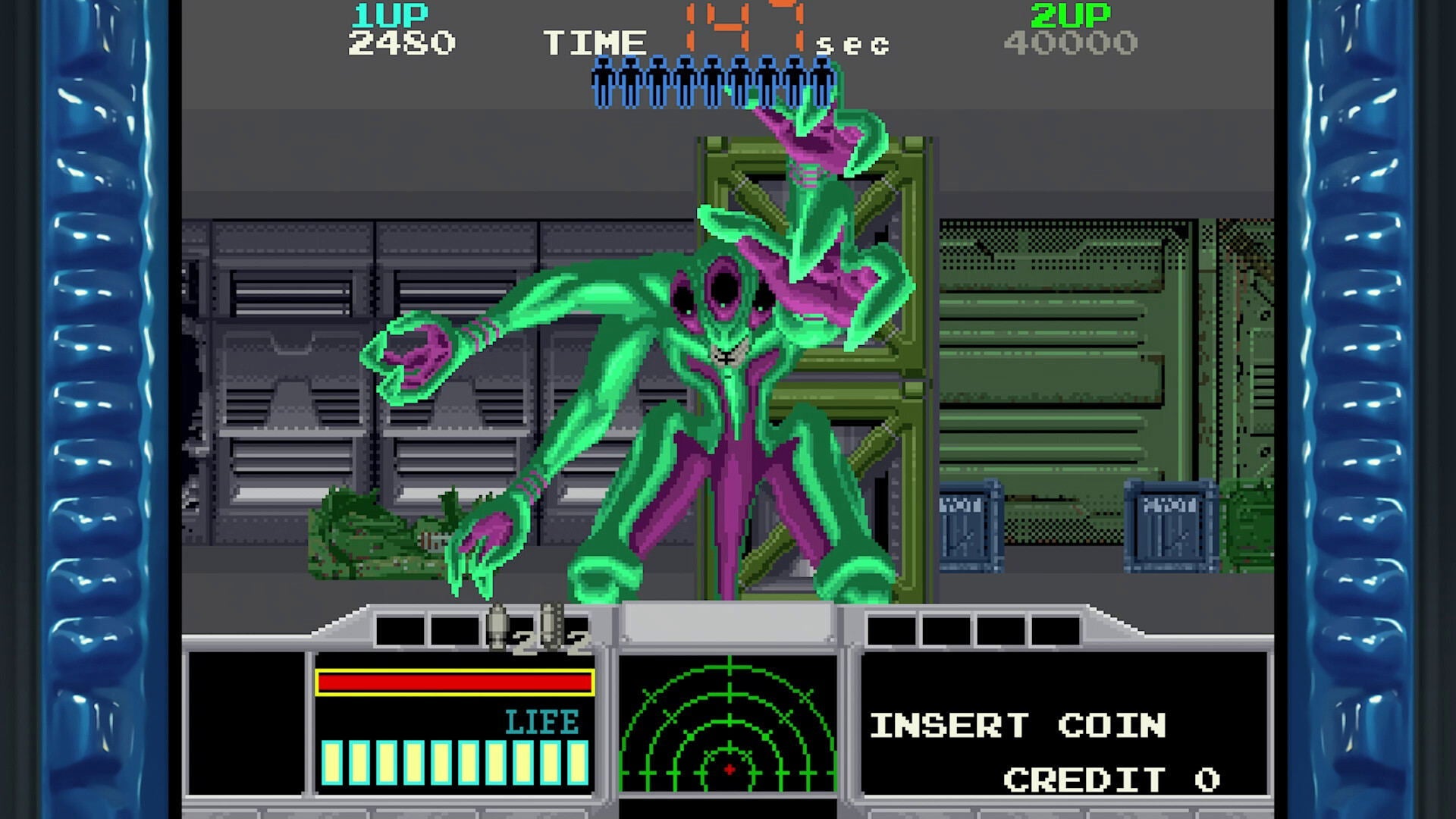 Vintage video game screen with a green alien character and coin insertion prompt.
