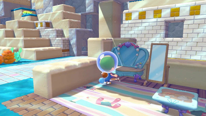 A stylized 3D-rendered scene showing a small character standing in a pastel-colored room with a blue vanity, mirror, striped rug, and sandy architectural background.
