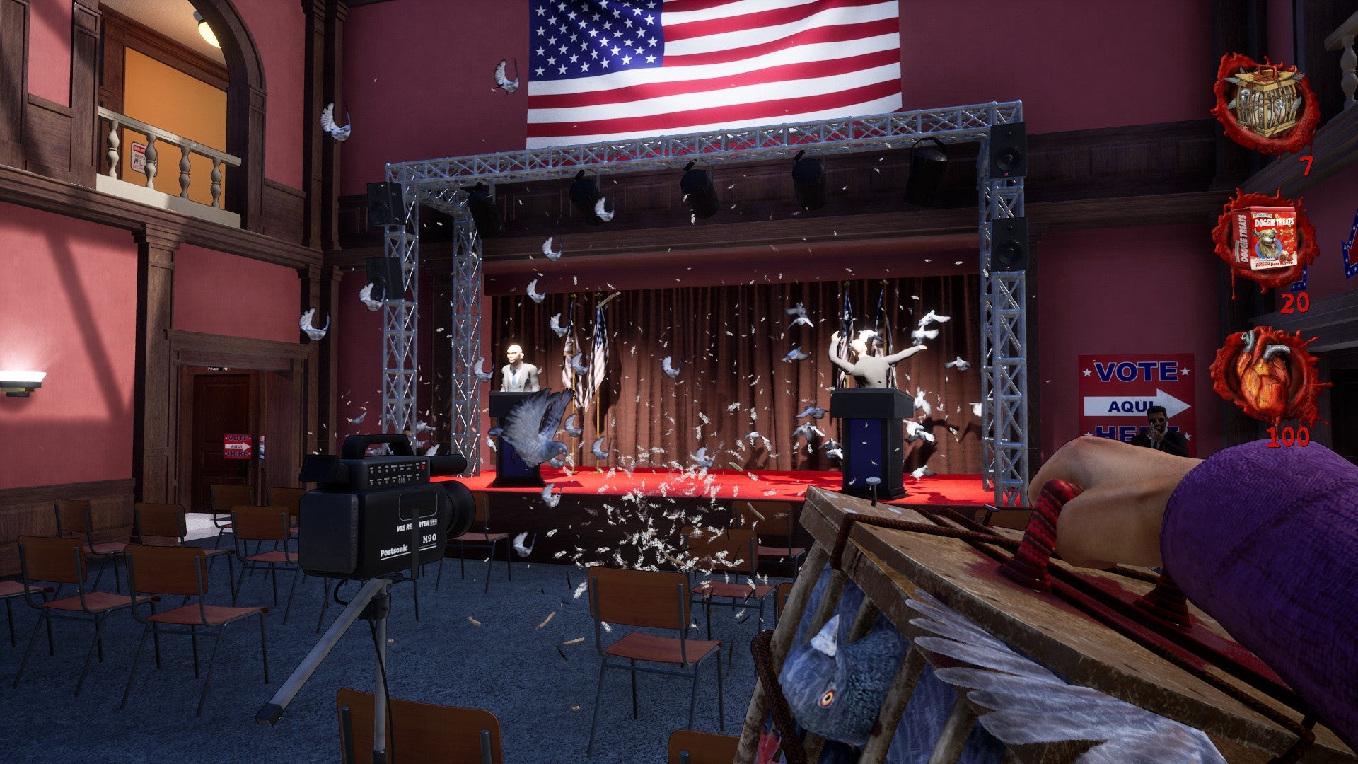 Dramatic scene with a stage, American flag, and various props in a room.