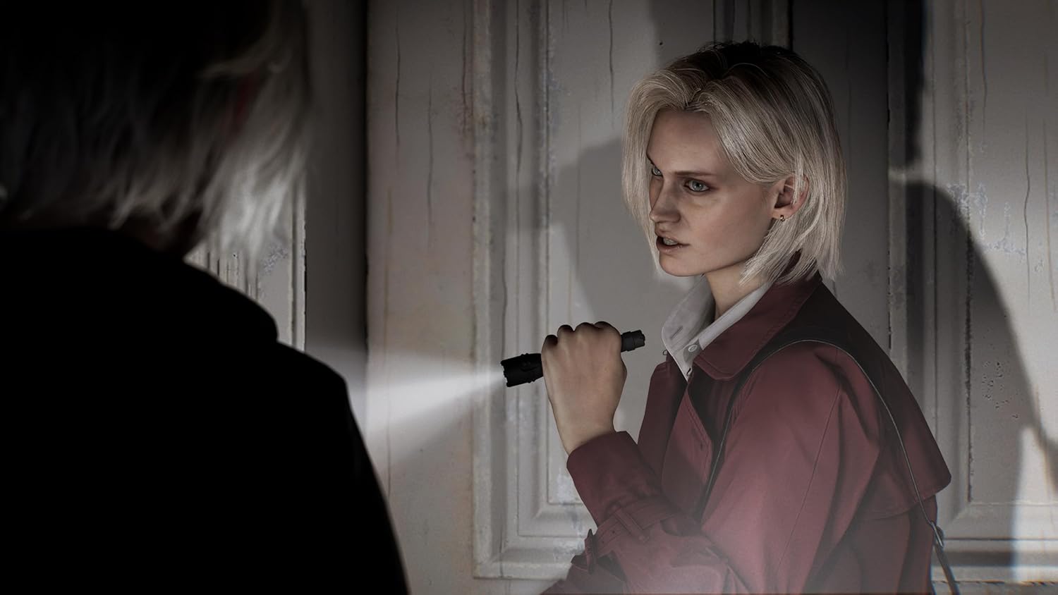 Person with a flashlight in a dimly lit room