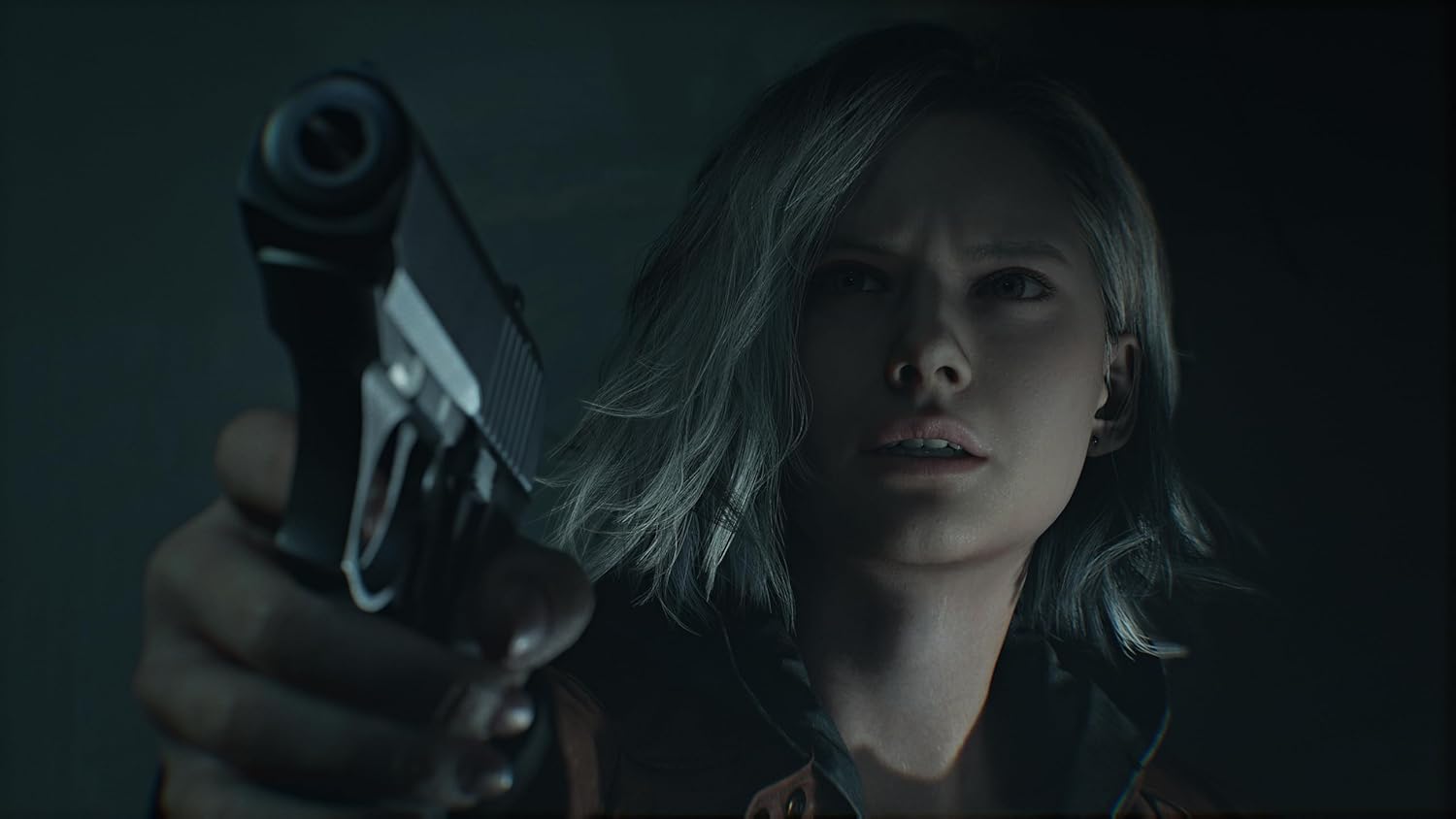 Person holding a gun in a dark setting