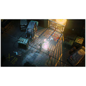 A top-down video game scene showing a character standing on a metal walkway in an industrial alley with vehicles, crates, and bright explosions or light effects.