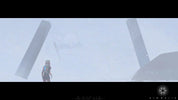 Person standing in front of large cylindrical structures with a foggy background