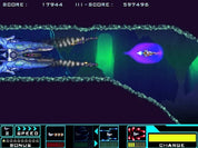 A screenshot from a retro space shooter video game, showing a blue futuristic spaceship firing at a purple enemy ship in a neon-lit tunnel. The top displays a score and high score, and the bottom features a colorful user interface with speed, stars, and charge indicators.