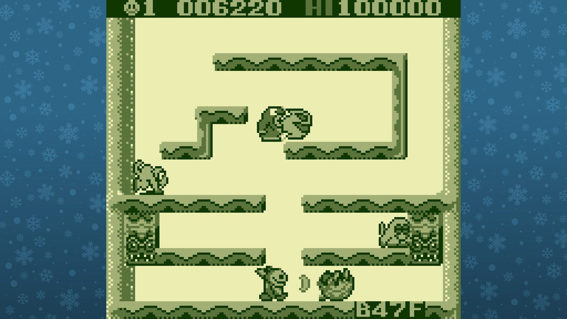 Game screen with a maze-like layout and characters on a blue background with snowflake pattern