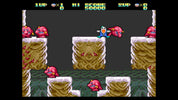 Screenshot of a classic platformer game with characters and obstacles on a snowy level.