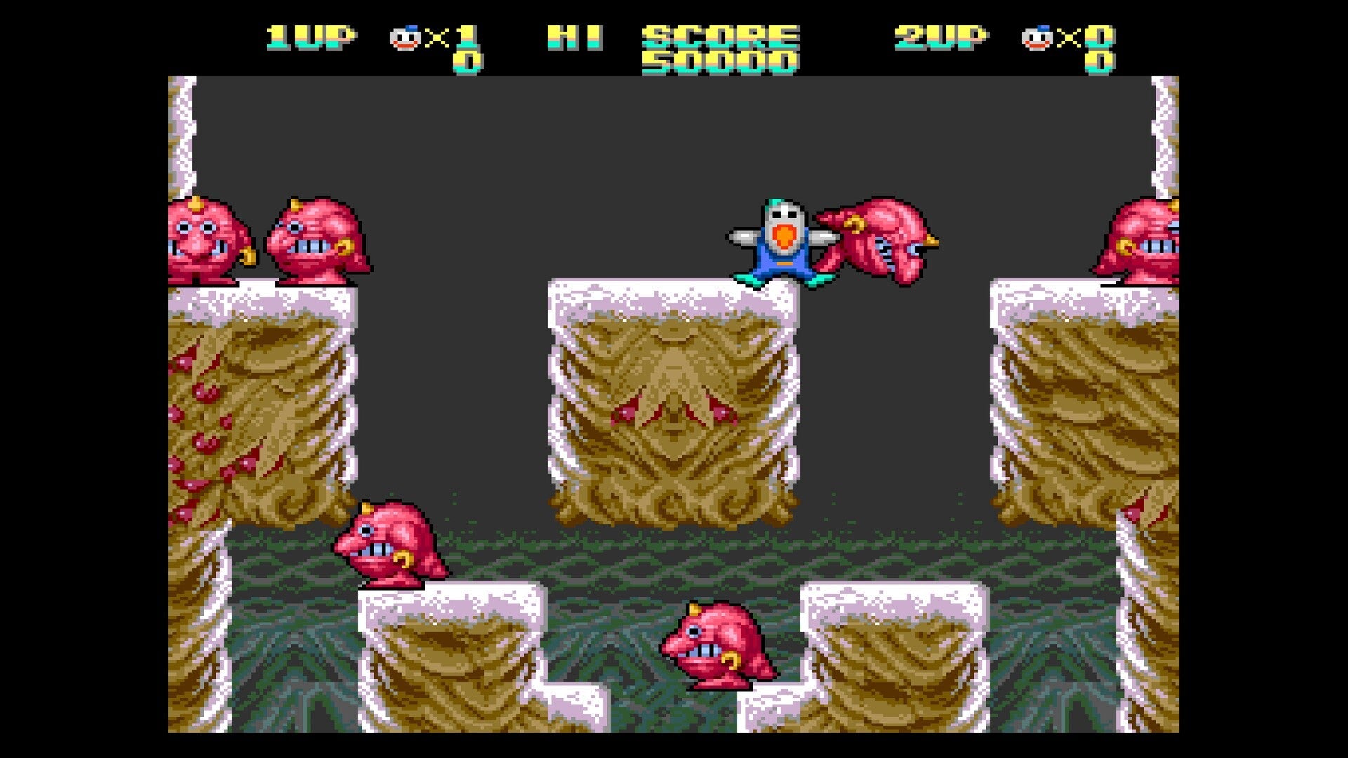 Screenshot of a classic platformer game with characters and obstacles on a snowy level.