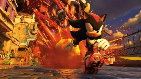 Shadow the Hedgehog riding a red hoverboard through a fiery, post-apocalyptic city street with buildings and sparks in the background.