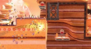 A stylized 2D platformer scene with layered tan and brown terrain, glowing yellow light effects, floating red circular elements, and small character-like figures in a surreal landscape.