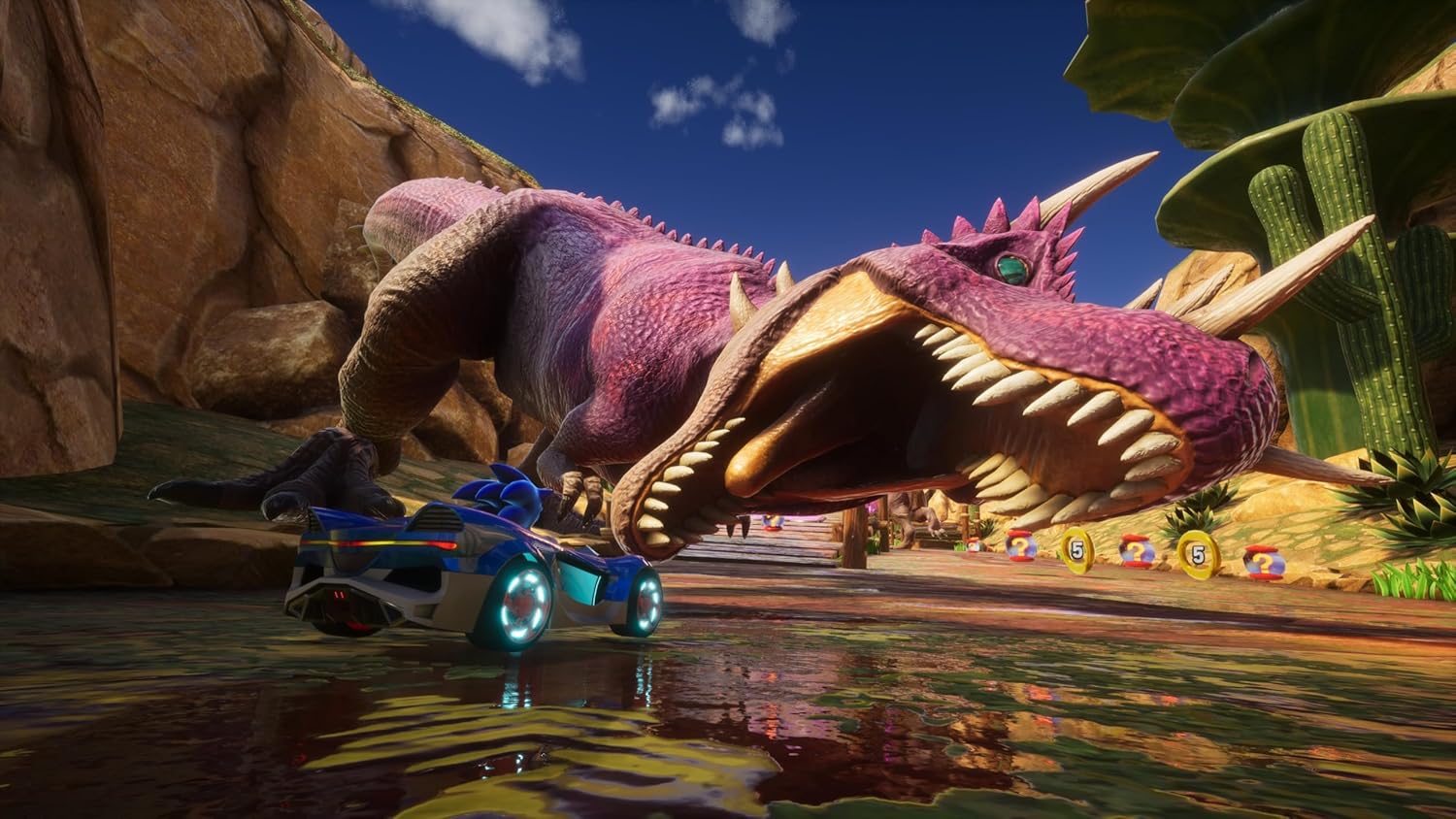 Pink dragon-like creature with a car on its back in a desert landscape