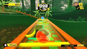 A colorful 3D racing game screenshot showing a spherical orange, red, and green ball racing down a winding track through a jungle-themed environment with banana pieces, scoreboards, and speed information.