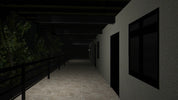 Dark hallway with railing on the left and windows on the right wall.