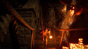 Dark, atmospheric scene with a character in a dungeon-like setting with torches and stone walls.
