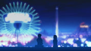 Silhouettes of two people sitting in front of a blurred night cityscape with bright blue and purple lights, including a large illuminated Ferris wheel on the left.