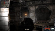 Dark, eerie interior with a flashlight and gun, possibly from a video game.